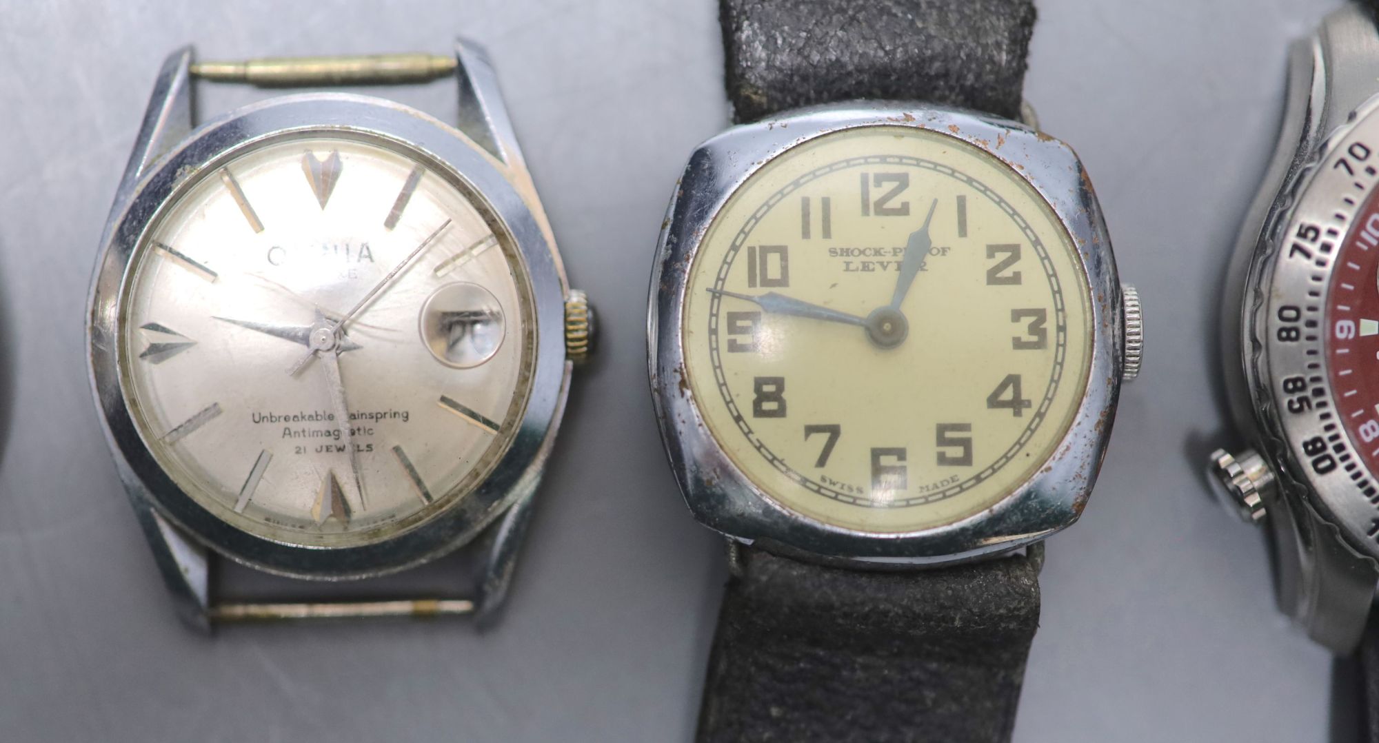 Seven assorted wrist watches including two Timex and an Omnia and two pocket watches.